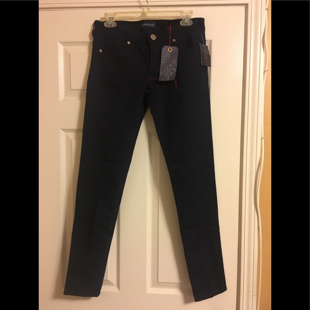 Brand new denim jeans still has price tag
